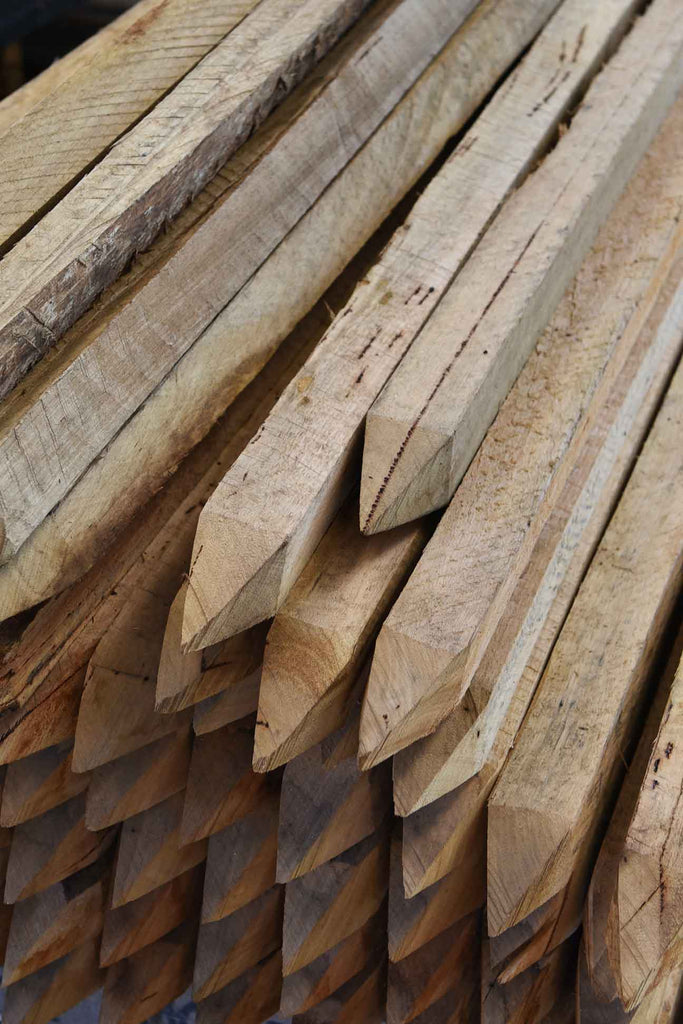 A Stack Of Natural Hardwood Stakes 
